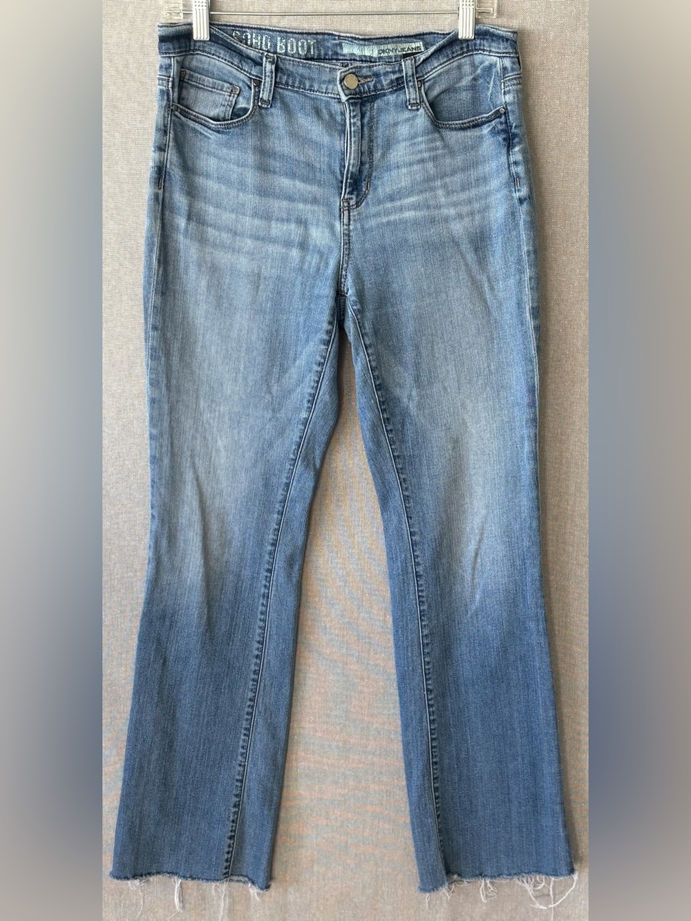 DKNY soho boot Women's Light Wash Blue Jeans size 6 fringe hem.